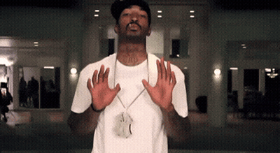 Man In White Shirt Wearing JD Pendant GIF