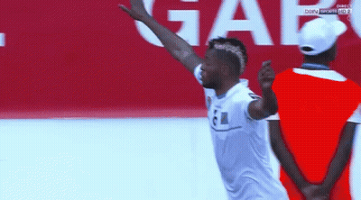Man In White Shirt With 61 Jumping GIF