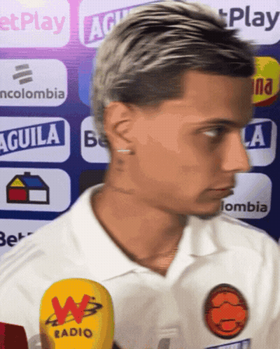 Man In White Shirt With Aguila Sign GIF