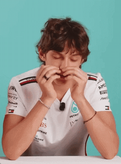 Man In White Shirt With AMD On Sleeves GIF
