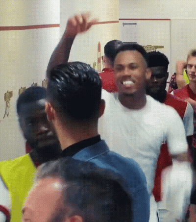 Man In White Shirt With Arm Raised GIF
