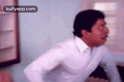 Man In White Shirt With Arms Outstretched GIF