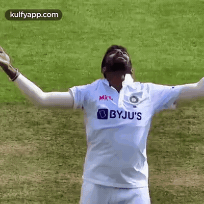 Man In White Shirt With Arms Outstretched Smiling GIF