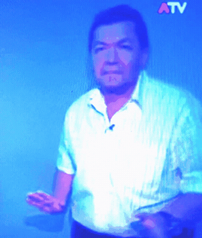 Man In White Shirt With ATV On Blue Background GIF