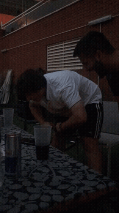 Man In White Shirt With Beer At Table GIF