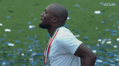 Man In White Shirt With Confetti And Strive GIF
