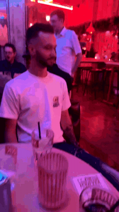 Man In White Shirt With Drink GIF