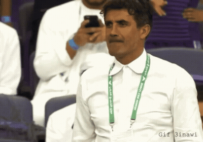 Man In White Shirt With Green Lanyard Saying Saudi Arabia GIF