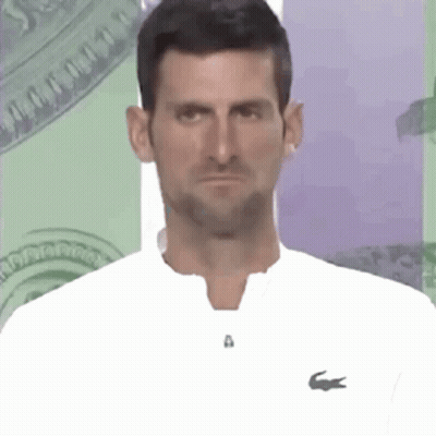 Man In White Shirt With Lacoste Logo Making Funny Face GIF