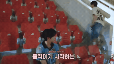 Man In White Shirt With Letter G In Stadium GIF