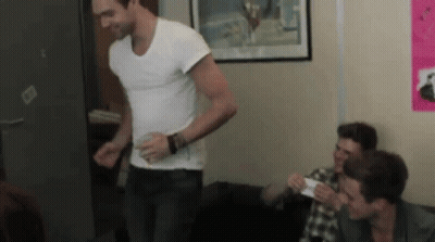 Man In White Shirt With Other Men GIF