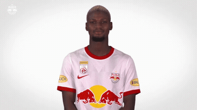 Man in White Shirt With Red Bulls