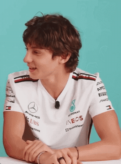 Man In White Shirt With Sleeve Sponsors GIF