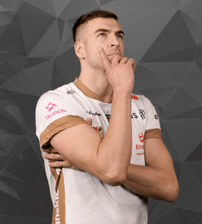 Man in White Shirt With Tauron on Sleeve