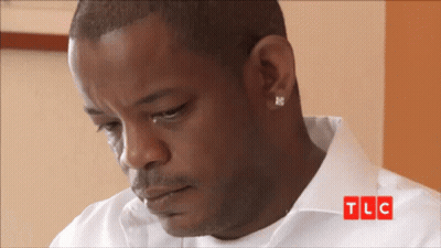 Man In White Shirt With TLC Logo GIF
