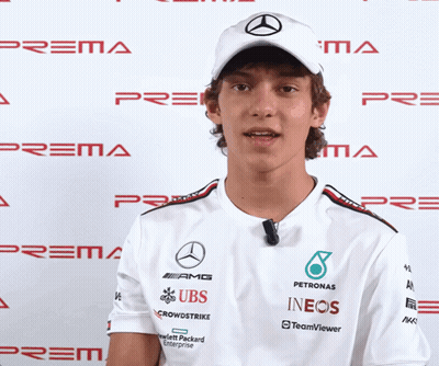 Man In White Shirt With UBS And INEOS Sponsors GIF