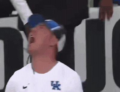 Man in White Shirt With UK Logo