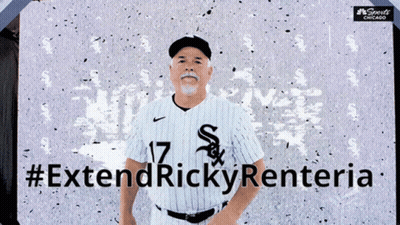Man In White Sox Jersey In Front Of #ExtendRickyRenteria Sign GIF