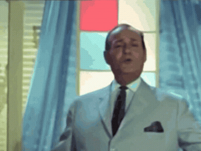 Man In White Suit And Black Tie GIF