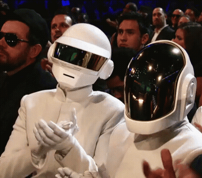 Man In White Suit And Helmet Next To Another Man In Helmet GIF