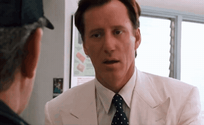 Man In White Suit And Polka Dot Tie Talking GIF