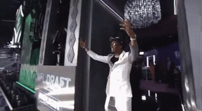 Man In White Suit At Draft Wall GIF