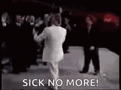 Man In White Suit Dancing On Stage GIF
