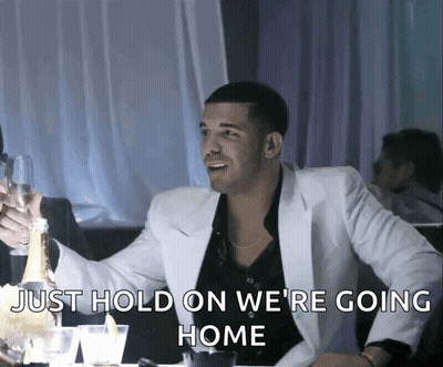 Man In White Suit Holding Champagne Bottle Says Just Hold On We Are Going Home GIF