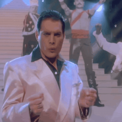 Man In White Suit Holding Glass GIF