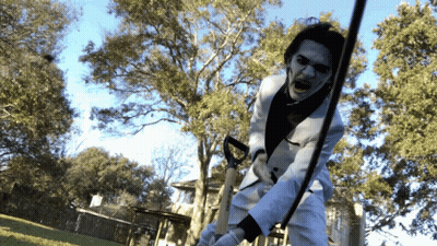 Man In White Suit Holding Sword GIF