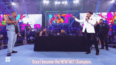 Man In White Suit Holding Trophy GIF