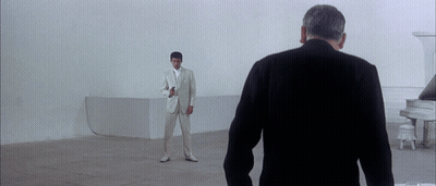 Man In White Suit In Front Of Piano GIF