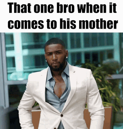Man In White Suit In Front Of Sign That One Bro When It Comes To His Mother GIF