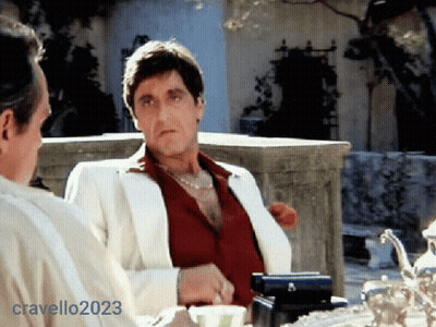 Man In White Suit Next To Man In Red Shirt GIF