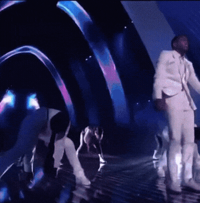 Man In White Suit On Stage GIF