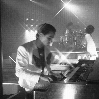 Man In White Suit Playing Keyboard GIF