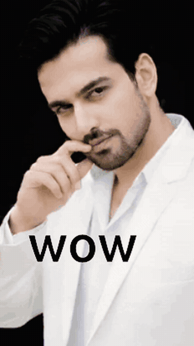 Man In White Suit Saying Wow GIF