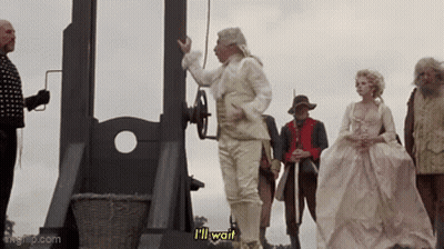 Man In White Suit Says I'll Wait At Guillotine GIF