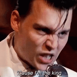 Man In White Suit Singing Into Microphone Saying Cause I'm The King GIF