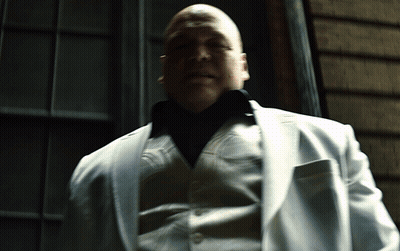 Man In White Suit Sitting With Eyes Closed GIF