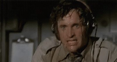 Man In White Suit Smiling At Window GIF