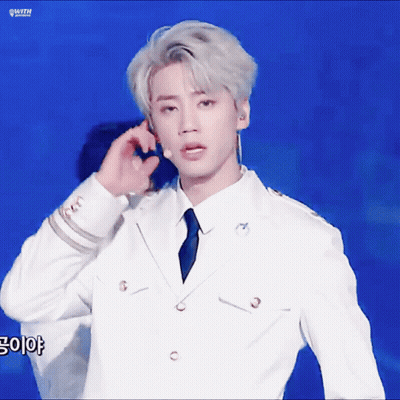 Man In White Suit Talking On Phone GIF