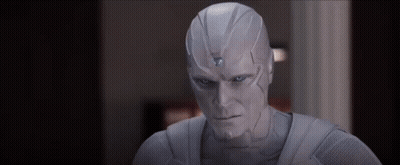 Man In White Suit With Blue Eye And Triangle GIF