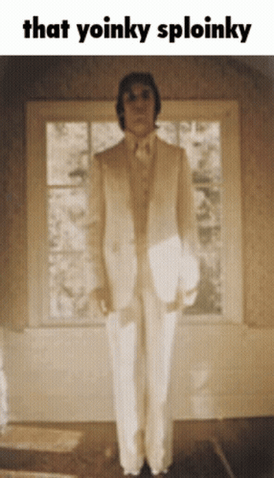 Man In White Suit With Yoinky Sploinky GIF