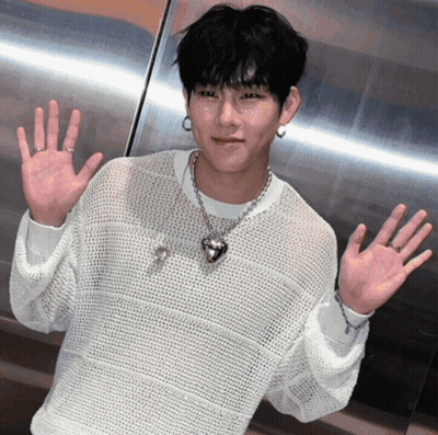 Man In White Sweater And Heart Shaped Necklace GIF