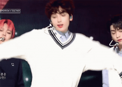 Man In White Sweater Dancing On Stage GIF