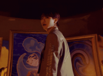 Man In White Sweater Sitting On Stool GIF