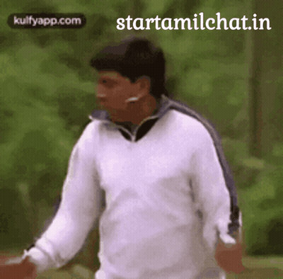 Man In White Sweater Walking In Park GIF
