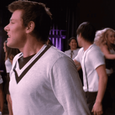 Man In White Sweater With Black V-Neck GIF