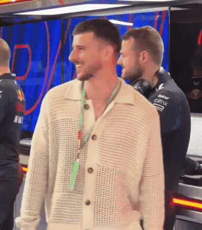 Man In White Sweater With Citrix Lanyard GIF